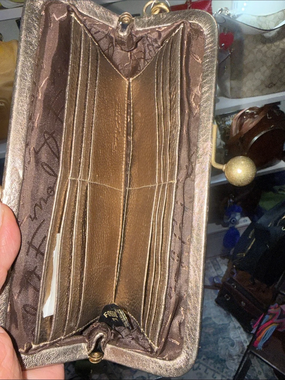 Fossil wristlet metallic